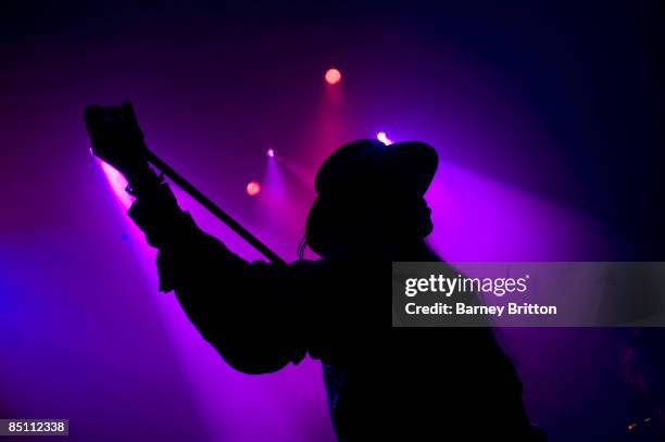 Photo of FIELDS OF NEPHILIM and Carl McCOY, Carl McCoy performing on stage, silhouette