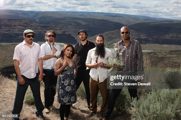 Photo of DENGUE FEVER and Ethan HOLTZMAN and David RALICKE and Chhom NIMOL and Paul SMITH and Zac HOLTZMAN and Senon WILLIAMS, Posed group portrait...