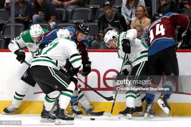 Brendan Ranford and Andrei Mironov of the Colorado Avalanche battles on the boards with Patrik Nemeth, Justin Dowling and Brian Flynn of the Dallas...