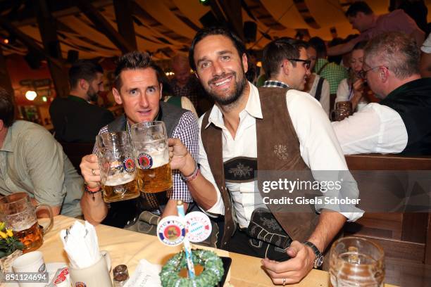 Miroslav Klose and Luca Toni, former FC Bayern soccer player during the Oktoberfest at Winzerer Faehndl tent at Theresienwiese on September 21, 2017...