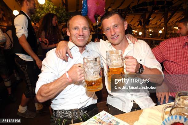 Hans Pfluegler and Ivica Olic, former FC Bayern soccer player, during the Oktoberfest at Winzerer Faehndl tent at Theresienwiese on September 21,...