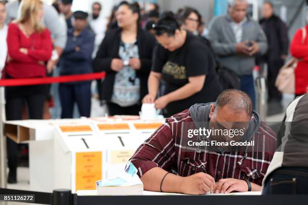 Early voters queue in Westfield Manukau City on September 22, 2017 in Auckland, New Zealand. Voters head to the polls tomorrow to elect the 52nd...