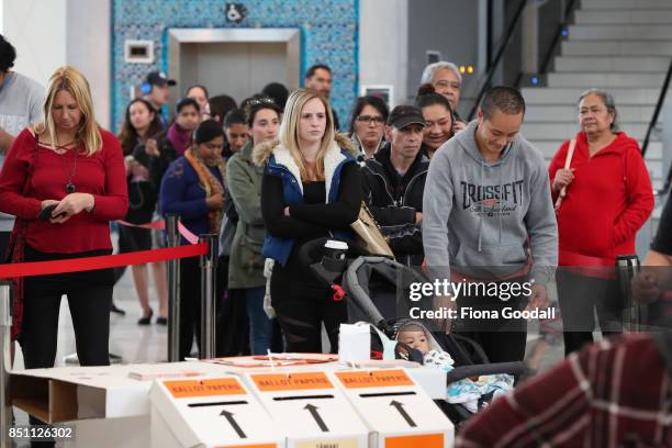 Early voters queue in Westfield Manukau City on September 22, 2017 in Auckland, New Zealand. Voters head to the polls tomorrow to elect the 52nd...