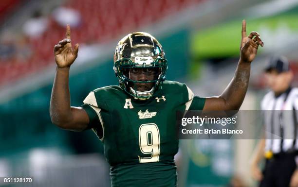 Quarterback Quinton Flowers of the South Florida Bulls celebrates following his 1 yard rushing touchdown during the fourth quarter of an NCAA...
