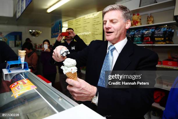 National Party leader Bill English serves ice-creams in Pokeno on September 22, 2017 in Auckland, New Zealand. Voters head to the polls on Saturday...