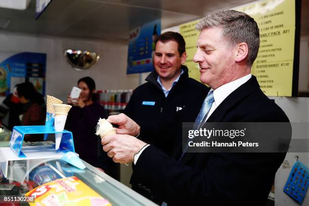 National Party leader Bill English serves ice-creams in Pokeno on September 22, 2017 in Auckland, New Zealand. Voters head to the polls on Saturday...