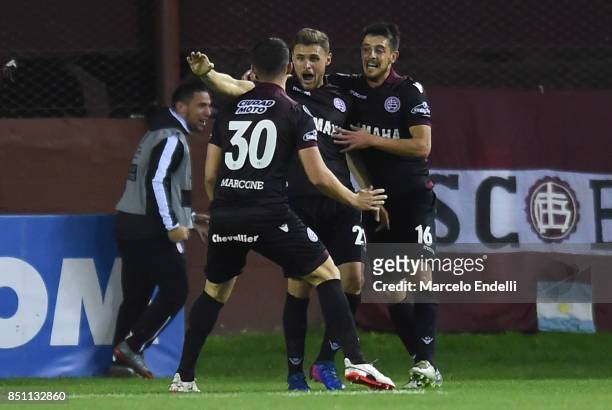 Nicolas Pasquini of Lanus celebrates with teammates after scoring the second goal of his team during the second leg match between Lanus and San...