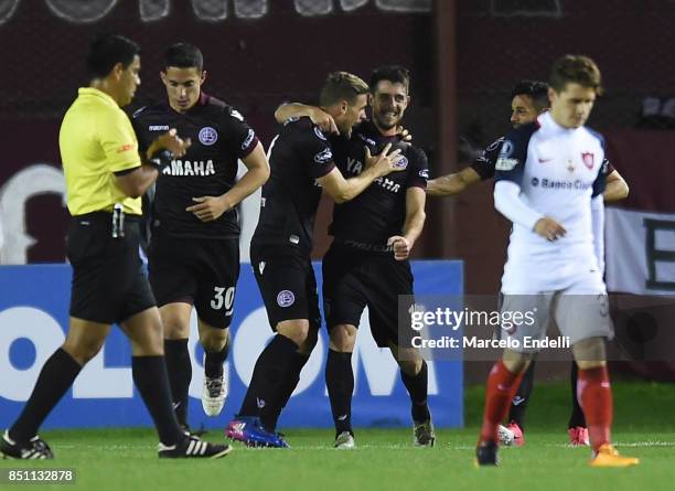 Nicolas Pasquini of Lanus celebrates with teammates after scoring the second goal of his team during the second leg match between Lanus and San...