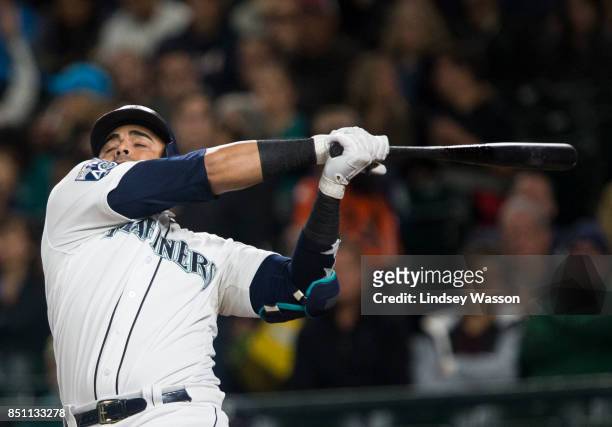 Nelson Cruz of the Seattle Mariners swings during his strikeout in the fourth inning against Cole Hamels of the Texas Rangers at Safeco Field on...