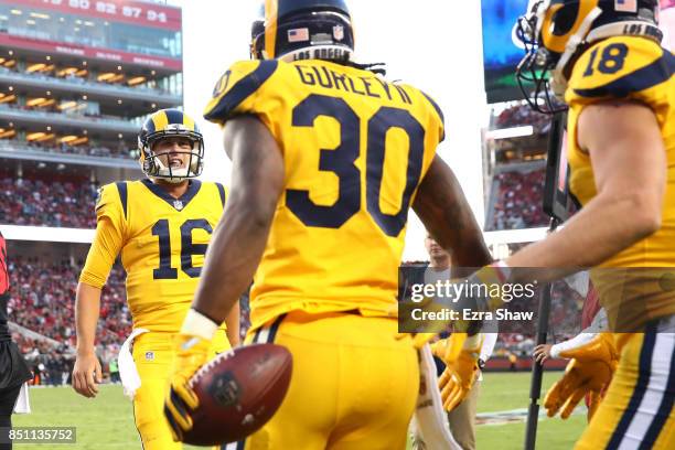 Todd Gurley of the Los Angeles Rams celebrates with Jared Goff after scoring against the San Francisco 49ers during their NFL game at Levi's Stadium...