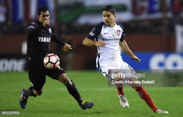 Jose Sand of Lanus fights for ball with Matias Caruzzo of San Lorenzo during the second leg match between Lanus and San Lorenzo as part of the...