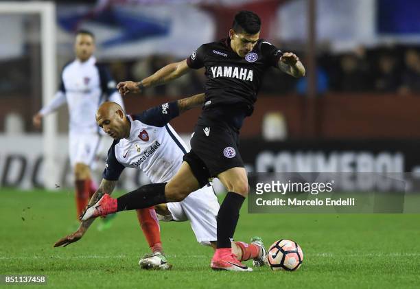 Leandro Maciel of Lanus fights for ball with Juan Mercier of San Lorenzo during the second leg match between Lanus and San Lorenzo as part of the...