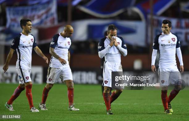 Players of San Lorenzo leave the field after the second leg match ends between Lanus and San Lorenzo as part of the quarter finals of Copa Conmebol...