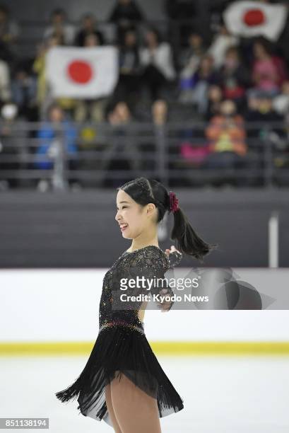 Japanese figure skater Mai Mihara smiles after performing in the women's short program at the Autumn Classic International in Montreal, Canada, on...