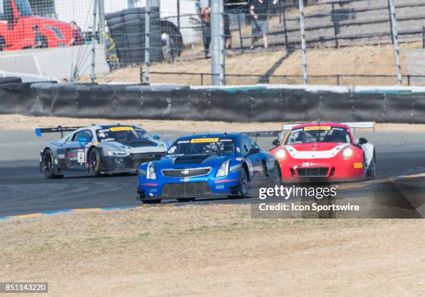 Michael Cooper , Cadillac Racing leads the pack from the hairpin turn 7 in the Cadillac ATS-V.R ahead of Patrick Long , Wright Motorsports in the...