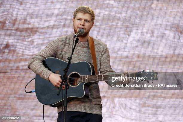 David Henshaw of Dancing Years performs outside Tate Modern, London, as part of a series of live music events organized by agit8 to raise awareness...