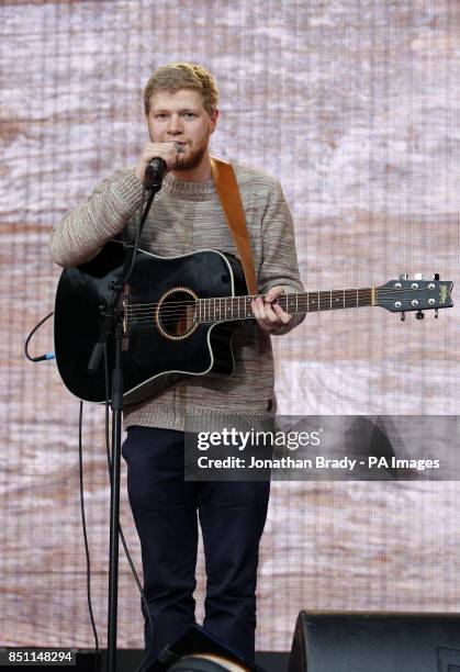 David Henshaw of Dancing Years performs outside Tate Modern, London, as part of a series of live music events organised by agit8 to raise awareness...