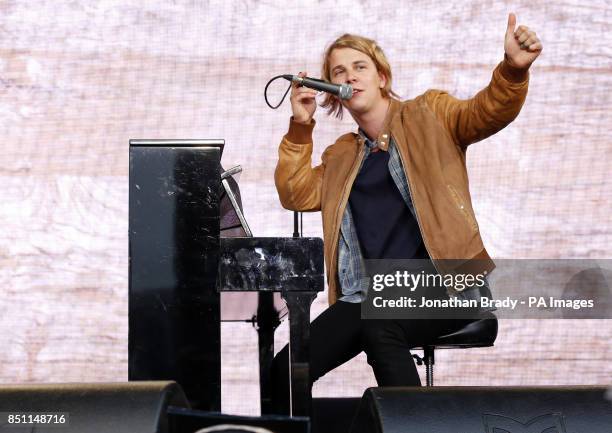 Tom Odell performs outside Tate Modern, London, as part of a series of live music events organised by agit8 to raise awareness of their campaign to...