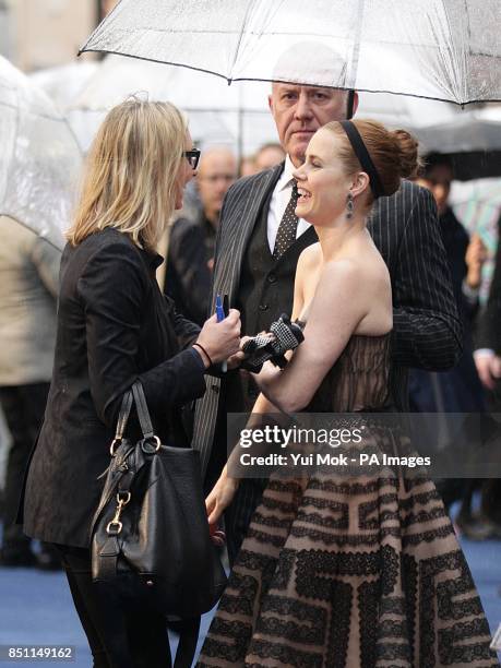 Amy Adams arriving in the pouring rain for the European premiere of Man of Steel at the Odeon Leicester Square, London