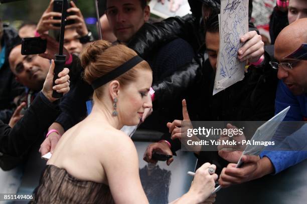 Amy Adams signing autographs as she arrives for the European premiere of Man of Steel at the Odeon Leicester Square, London