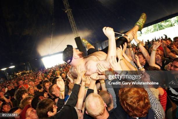 Photo of FUCKED UP, Pink Eyes performing on stage, audience
