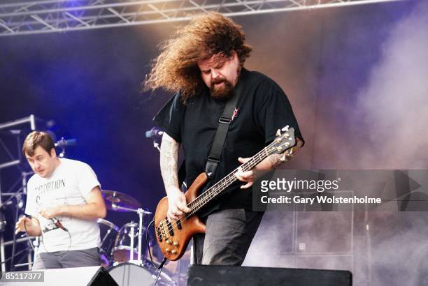 Photo of NAPALM DEATH and Shane EMBURY and Mark GREENWAY; Mark "Barney" Greenway and Shane Embury performing on stage