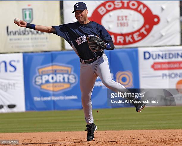 Infielder Derek Jeter of the New York Yankees throws out a runner against the Toronto Blue Jays February 25, 2009 at Dunedin Stadium in Dunedin,...