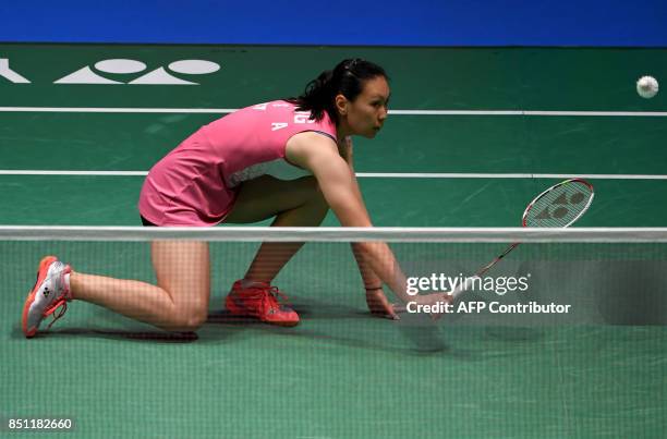 Zhang Beiwen of the US hits a return towards Nozomi Okuhara of Japan during their women's singles quarter-final match at the Japan Open Badminton...