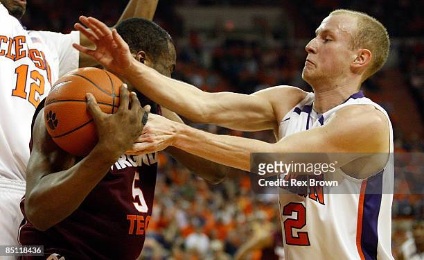 Terrence Oglesby of the Clemson Tigers battles Dorenzo Hudson of the Virginia Tech Hokies for this rebound at Littlejohn Coliseum on February 25,...