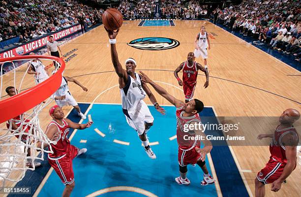 Josh Howard of the Dallas Mavericks puts up a floater in the lane against the Milwaukee Bucks at the American Airlines Center February 25, 2009 in...