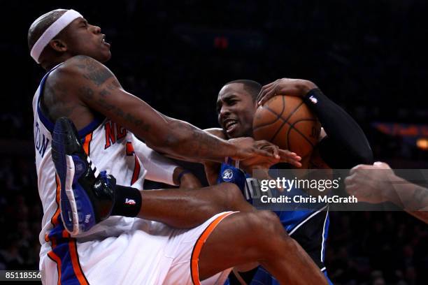 Dwight Howard of the Orlando Magic is fouled by Al Harrington of the New York Knicks at Madison Square Garden February 25, 2009 in New York City....