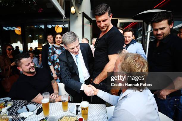 National Party leader Bill English meets guests at the Viaduct Harbour on September 22, 2017 in Auckland, New Zealand. Voters head to the polls on...