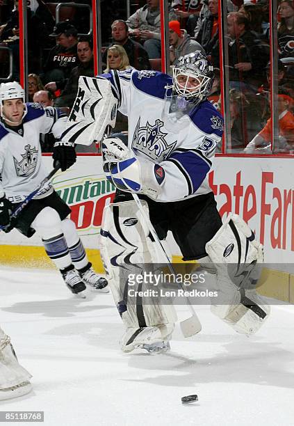 Erik Ersberg of the Los Angeles Kings shoots the puck from behind his net against the Philadelphia Flyers at the Wachovia Center February 25, 2009 in...