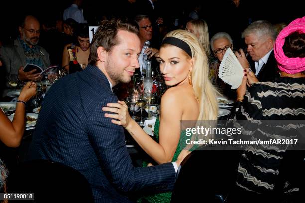 Derek Blasberg and Hailey Baldwin attend the dinner at the amfAR Gala Milano on September 21, 2017 in Milan, Italy.