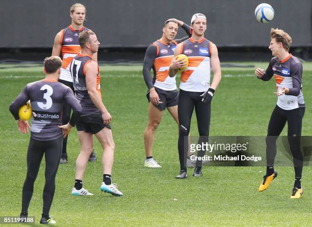 Lachie Whitfield of the Giants heads the soccer ball during the Greater Western Sydney Giants AFL training session at Melbourne Cricket Ground on...