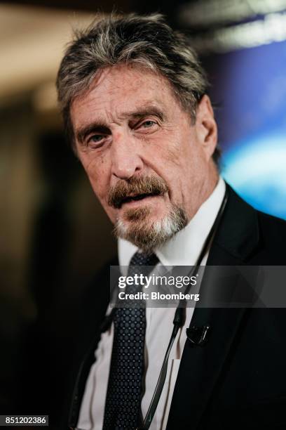 John McAfee, founder of McAfee Associates Inc. And chief cybersecurity visionary at MGT Capital Investments Inc., speaks during a Bloomberg...