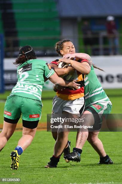 Aroha Nuku and Rikki-Lee Rawleigh of Manawatu try to bring down Toka Natua of Waikato during the round four Farah Palmer Cup match between Manawatu...