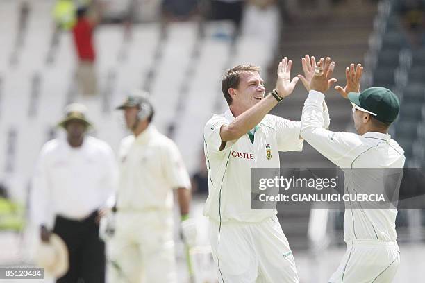 South African bowler Dale Steyn and South African fielder Neil Mckenzie celebrate on February 26, 2009 after sending out Australian batsman Simon...