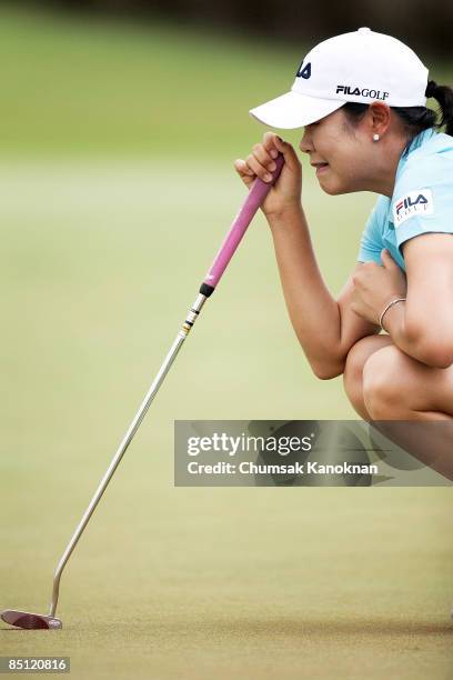 Hee-Won Han of South Korea lines up a putt during day one of the Honda LPGA Thailand 2009 at Siam Country Club Plantation on February 26, 2009 in...