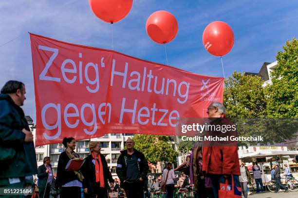 Supporters show a banner with the inscription attitude against agitation or Haltung gegen Hetze during SPD electoral campaign on September 21, 2017...