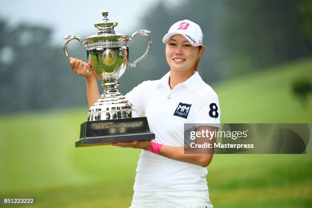 Eri Fukuyama of Japan poses with the trophy after winning the Chugoku Shimbun Choopi Ladies Cup at the Geinan Country Club on September 22, 2017 in...