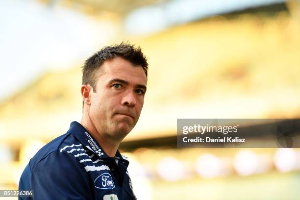 Cats head coach Chris Scott walks from the field prior to the First AFL Preliminary Final match between the Adelaide Crows and the Geelong Cats at...