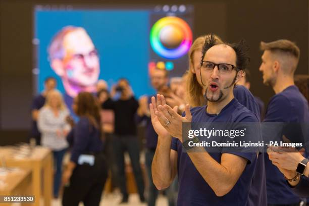 Apple employees welcome customers to the Apple Store on Regent Street, London, as the iPhone 8 and iPhone 8 Plus go on-sale in the UK.