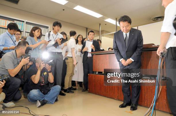 Dentsu Inc. President Toshihiro Yamamoto apologises in front of reporters after a hearing at the Tokyo Summary Court on September 22, 2017 in Tokyo,...