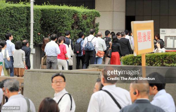 People seeking court seats for Dentsu Inc. Hearing queue in front of the Tokyo Summary Court on September 22, 2017 in Tokyo, Japan. The president of...