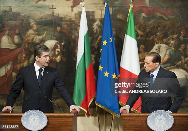 Bulgaria's President Georgi Parvanov looks to Italy's Prime Minister Silvio Berlusconi during their joint press conference at Rome's Papazzo Chigi on...