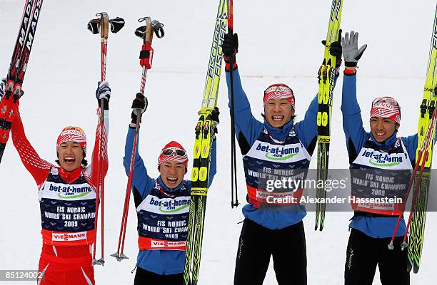 Norihito Kobayashi, Taihei Kato, Akito Watabe and Yusuke Minato of Japan celebrate after winning the Gold medal during the 4X5KM Relay competition of...