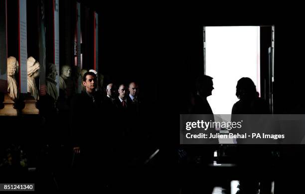 First Lady Michelle Obama is silhouetted in the doorway with Provost Dr. Patrick Prendergast watched by the Secret Service during their visit to the...