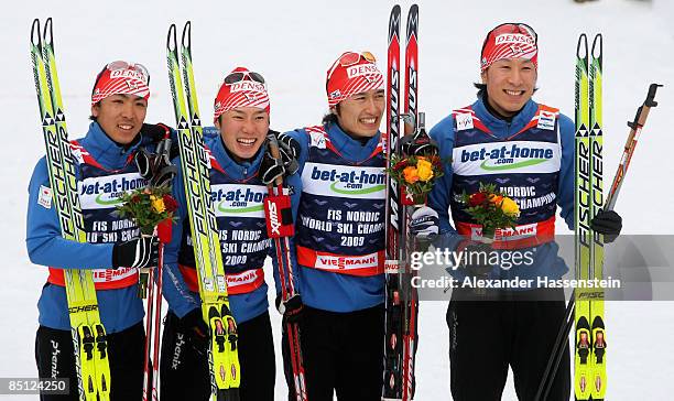 Yusuke Minato, Taihei Kato, Norihito Kobayashi and Akito Watabe of Japan celebrate after winning the Gold medal during the 4X5KM Relay competition of...