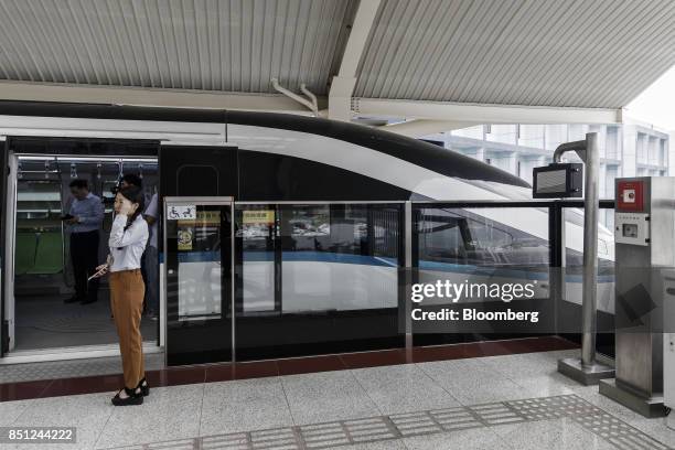 Co. SkyRail monorail train stands at a station at the company's headquarters in Shenzhen, China, on Thursday, Sept. 21, 2017. China will likely order...